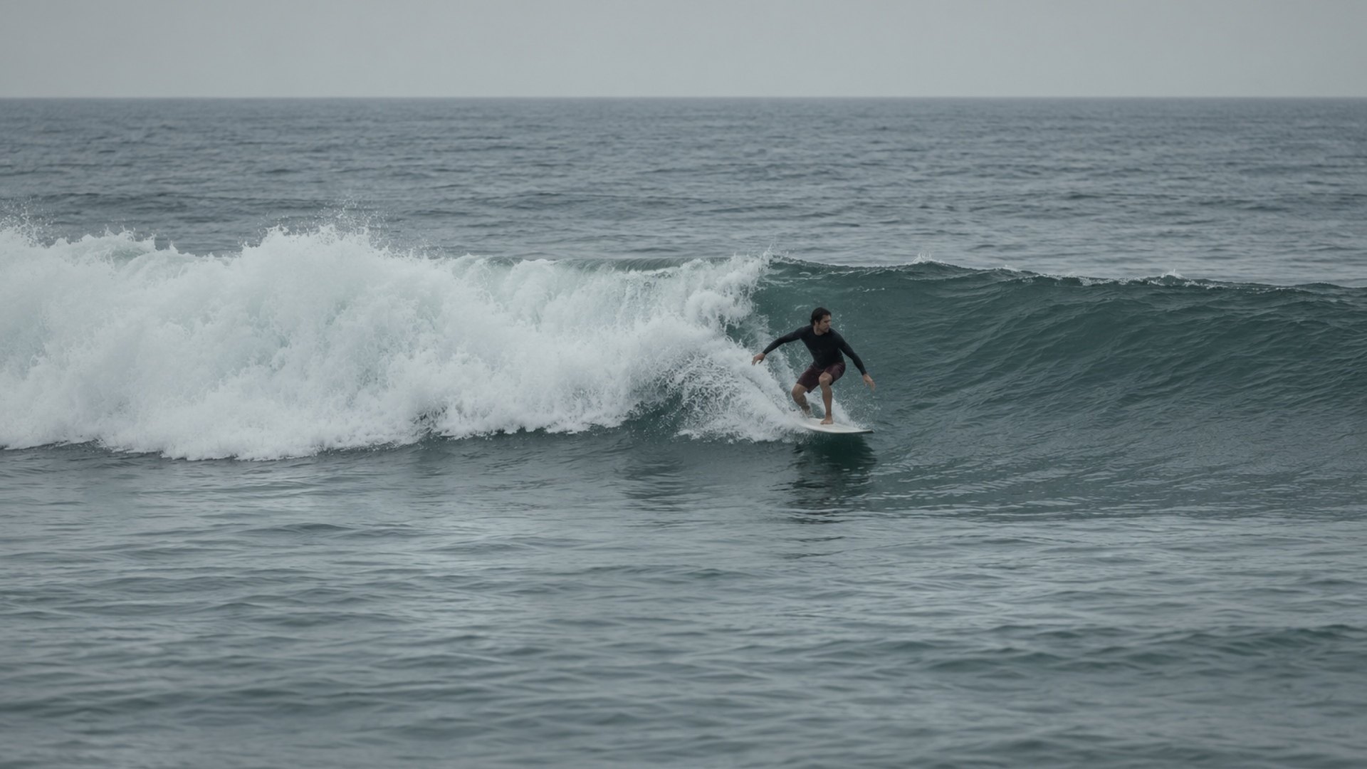 Surfer riding an ocean wave